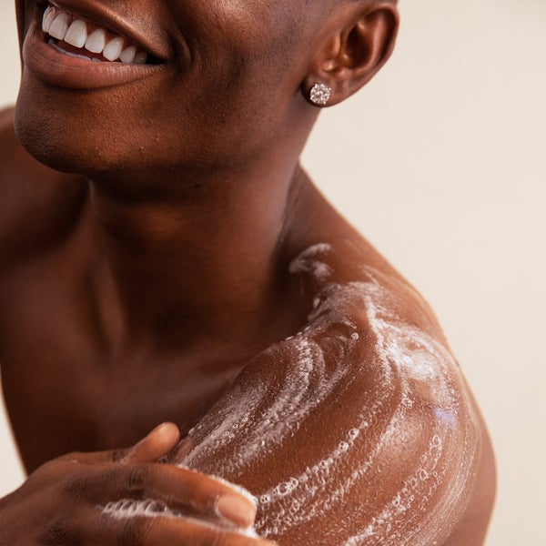 Model Lathering Up With Body and Hand Wash